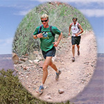 Two runners traveling along the North Kaibab Trail.