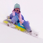 Girl Snow Sledding