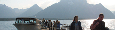 visitors returning from a dinner cruise on Jackson Lake