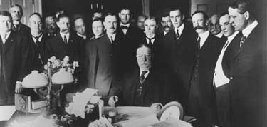 100 years ago, John Lorenzo Hubbell stands behind William Howard Taft as he signs law creating Arizona on February 14, 1912.