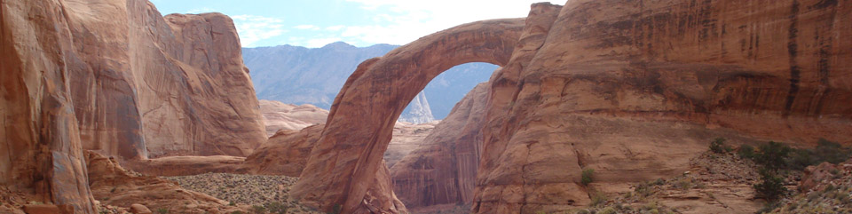 As you approach the viewing area from the docks, Rainbow Bridge peeks out from behind the cliffs. As you approach the viewing area from the docks, Rainbow Bridge peeks out from behind the cliffs.