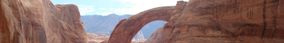 As you approach the viewing area from the docks, Rainbow Bridge peeks out from behind the cliffs.