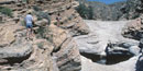 Hikers cautiously approach the Ernst Tinaja Hikers cautiously approach the Ernst Tinaja