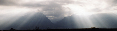 Sunlight pouring over the Chisos Mountains