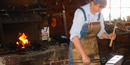 Working in the blacksmith shop. Working in the blacksmith shop.