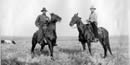 Two cowboys on their horses. Two cowboys on their horses.