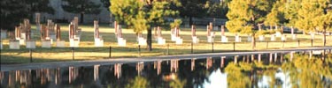 Empty chairs reflected in the pool