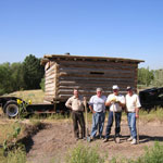 Partners help stabilize a cabin