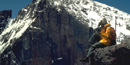 a photo of a hiker below the Diamond on Longs Peak a photo of a hiker below the Diamond on Longs Peak