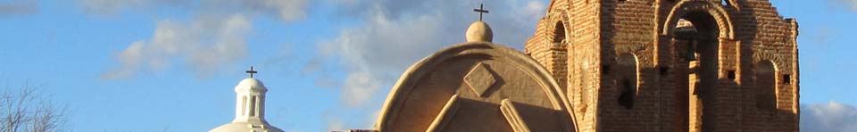 Sunlight illuminates the top of historic Mission San José de Tumacácori church.