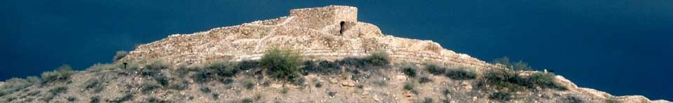 A storm gathers behind the pueblo at Tuzigoot