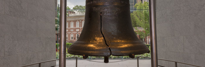 Color photo showing the Liberty Bell, from the shoulder down to the lip, with a focus on the crack.