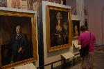 Visitors looking at portraits in Second Bank
