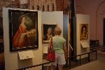 Woman looking at portrait in Second Bank