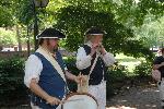 Costumed Actors performing near Second Bank