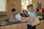 Ranger assisting visitor with map