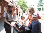 Ranger and visitors with baby Ben armonica