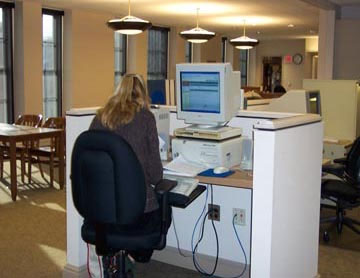 Woman using reference services in library