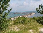 stone wall in Lake Michigan, dune grass in front
