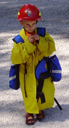 Child wearing wildland fire clothing