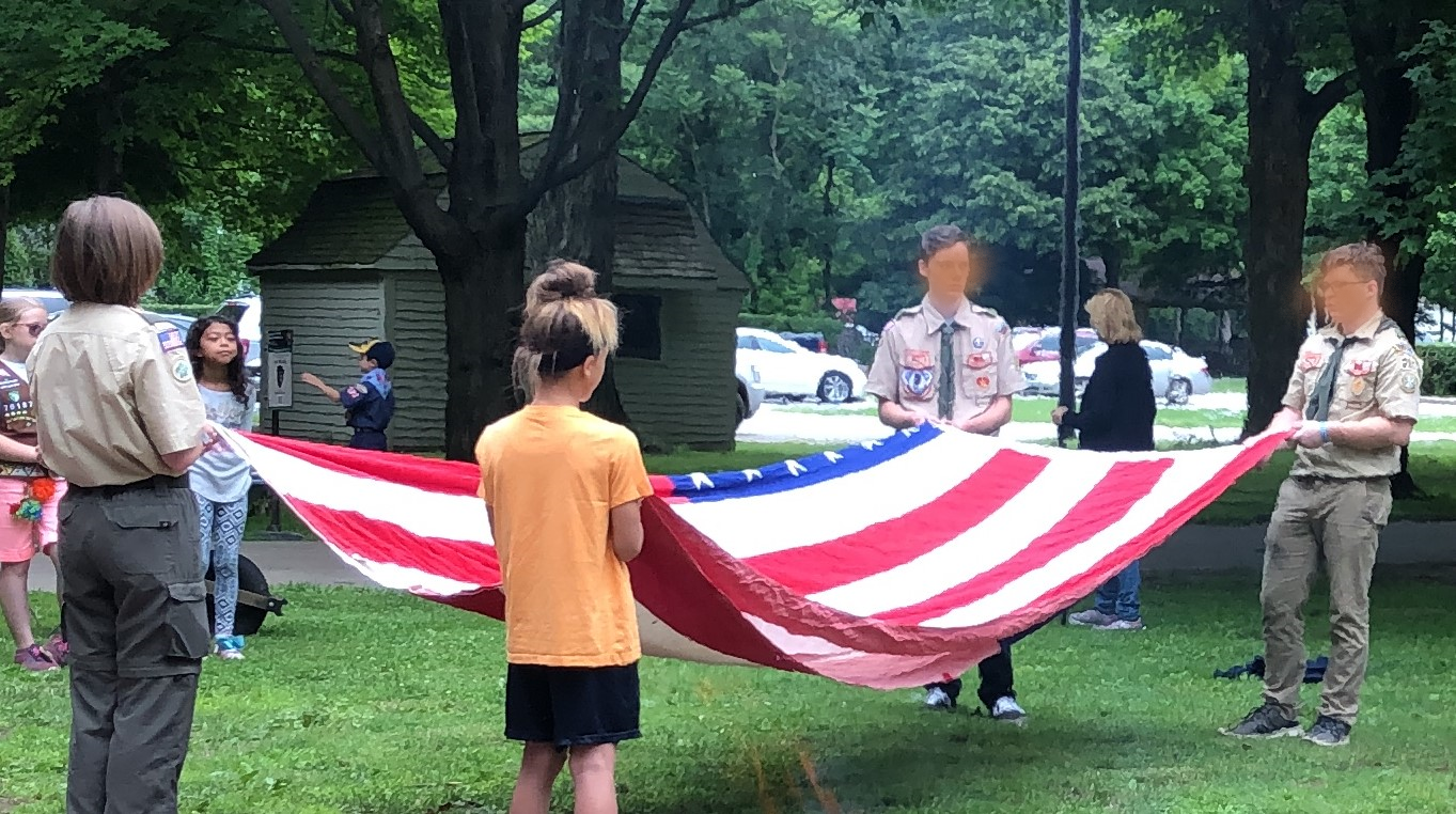 Scouts retiring flags for flag day