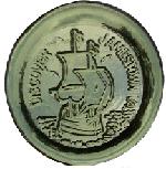 Circular green glass paper weight with the image of a sailing ship and the text: DISCOVER JAMESTOWN Circular green glass paper weight with the image of a sailing ship and the text: DISCOVER JAMESTOWN