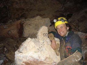 A caver at a survey station