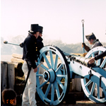 American troops load cannon for firing.