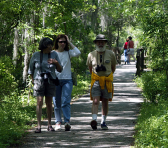 Image of visitors walking along a boardwalk trail
