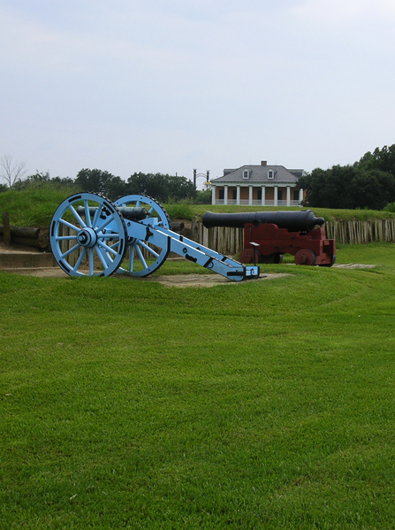 Image of battlefield with 1815 cannons and historic home in background