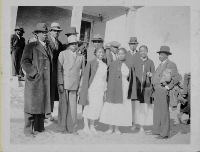 African American men and women in mid-1900s clothes