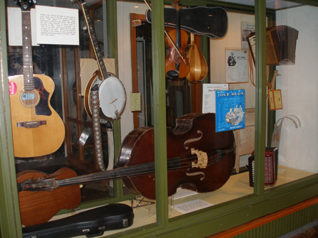 Image of exhibit case full of musical instruments