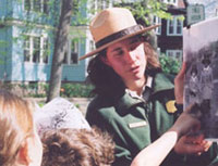 Children on an adventure with a ranger at John F. Kennedy National Historic Site.