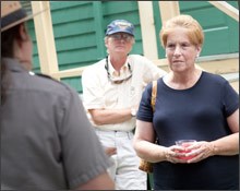 A park visitor listens to a ranger talk about the campaign teas
