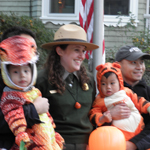 A Ranger poses with Trick-or-Treaters at last year's celebration