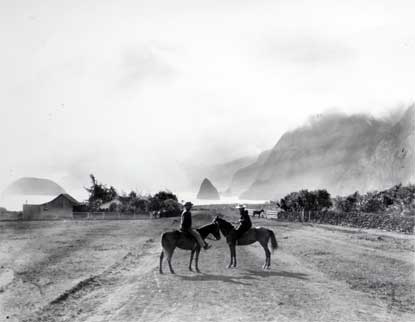 Two horsemen on the road at Kalawao, ca late 1800s