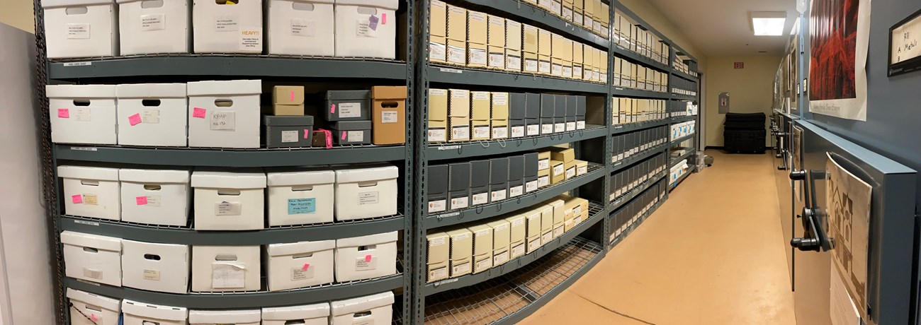 rows of boxs on metal shelf