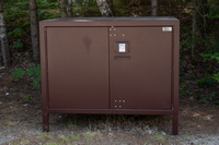A large brown lock box to prevent bear break-ins.