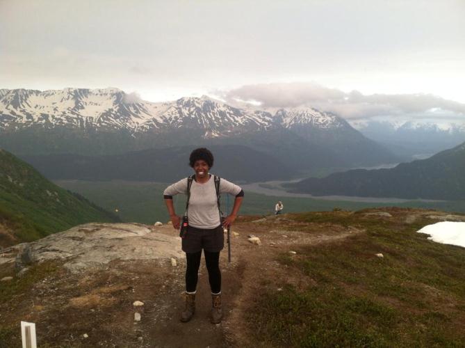Image of SCA intern standing at the end of the Harding Icefield.