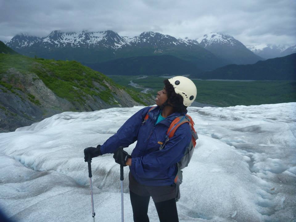 Author, standing on Exit Glacier, dressed in ice climbing gear. 