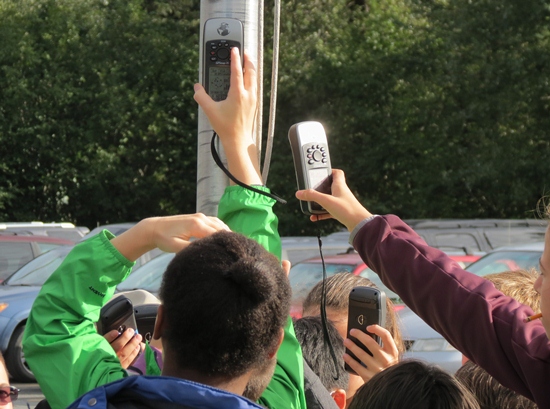 Students at the local elementary school learn to take a GPS waypoint.