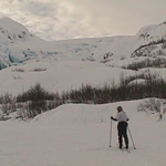 skier on Exit Glacier's outwash plain