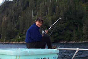 Visitor fishing in Kenai Fjords