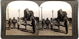 Historic Photo: A stereoview of a Calumet & Hecla rescue crew near a shafthouse, circa 1910.