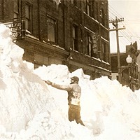 Historic Photo: Man shoveling snow on Hecla Street in Laurium in 1933.