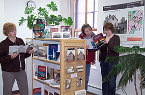 Visitors browse through a selection of items at a sales outlet operated by the Isle Royale Natural History Association at Keweenaw National Historical Park headquarters.