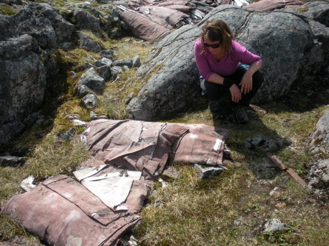 [Photo 8] Nicole assessing the condition of the collapsible boats near the Summit