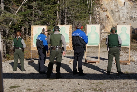 Law Enforcement personnel shooting guns Law Enforcement personnel shooting guns