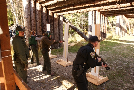 Law Enforcement Personnel shooting shotguns Law Enforcement Personnel shooting shotguns