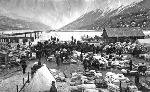 historic photo, piles of goods on muddy waterfront